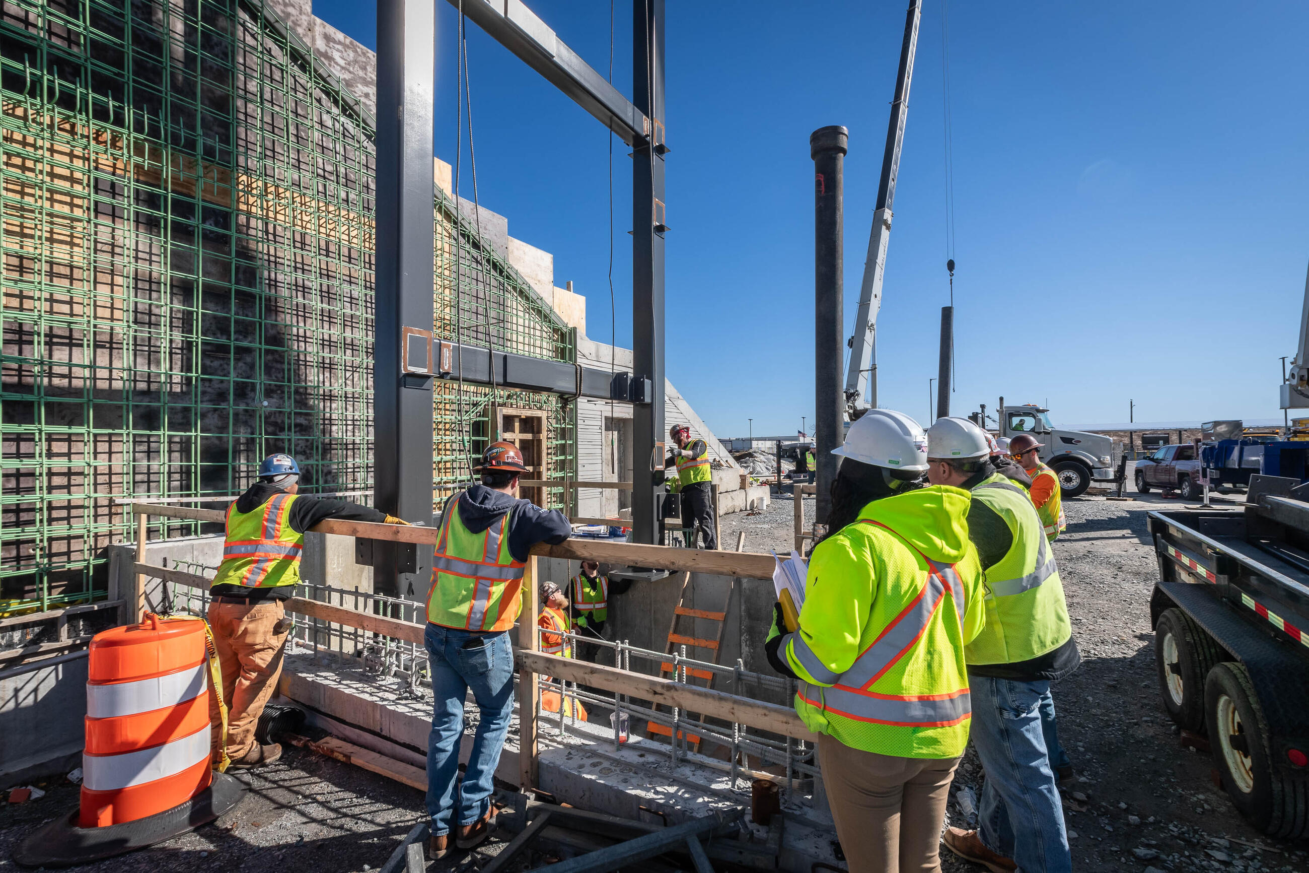 Construction workers meeting at a construction site at New Bedford station