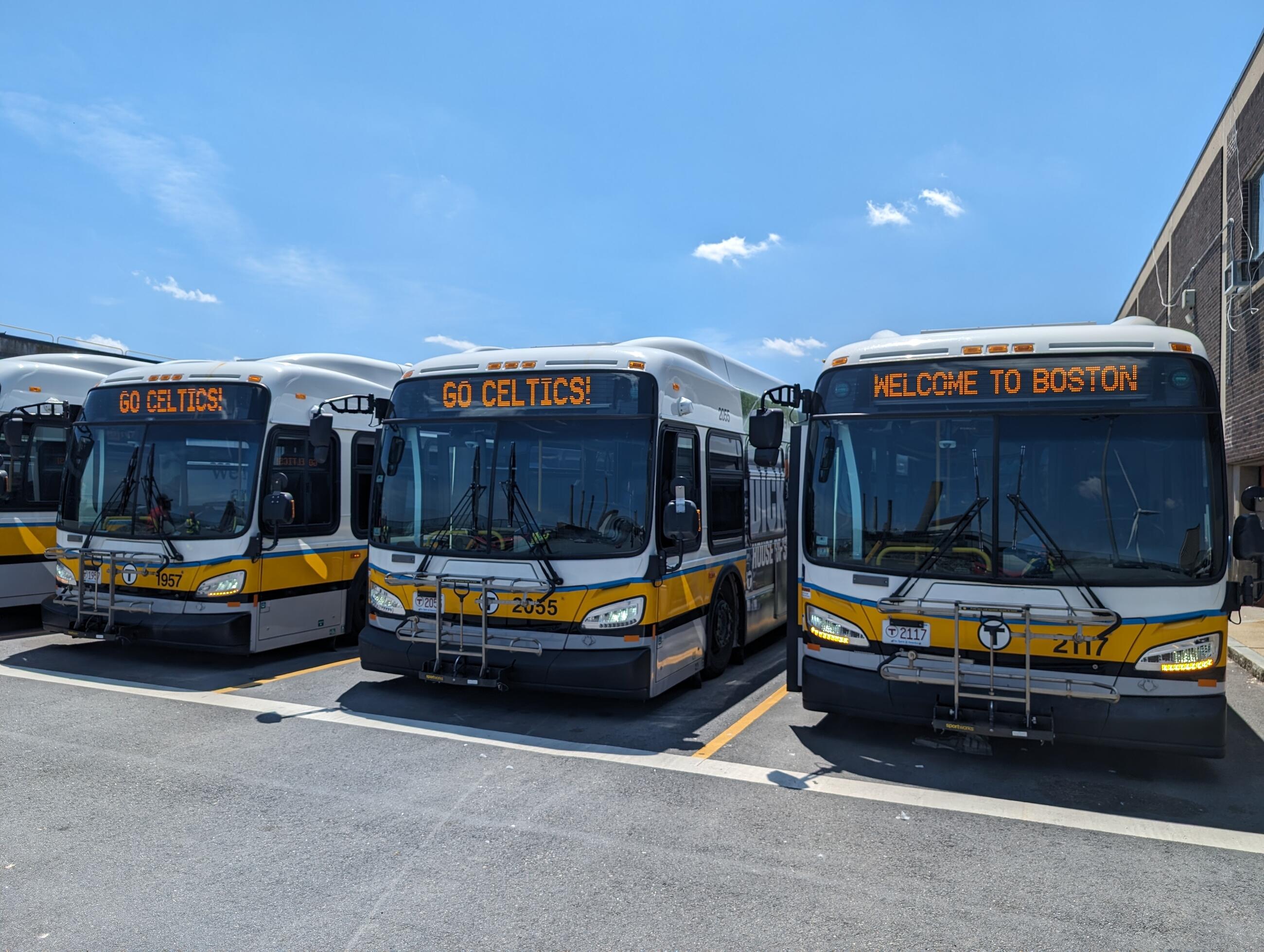 MBTA buses with Go Celtics displayed on digital screens