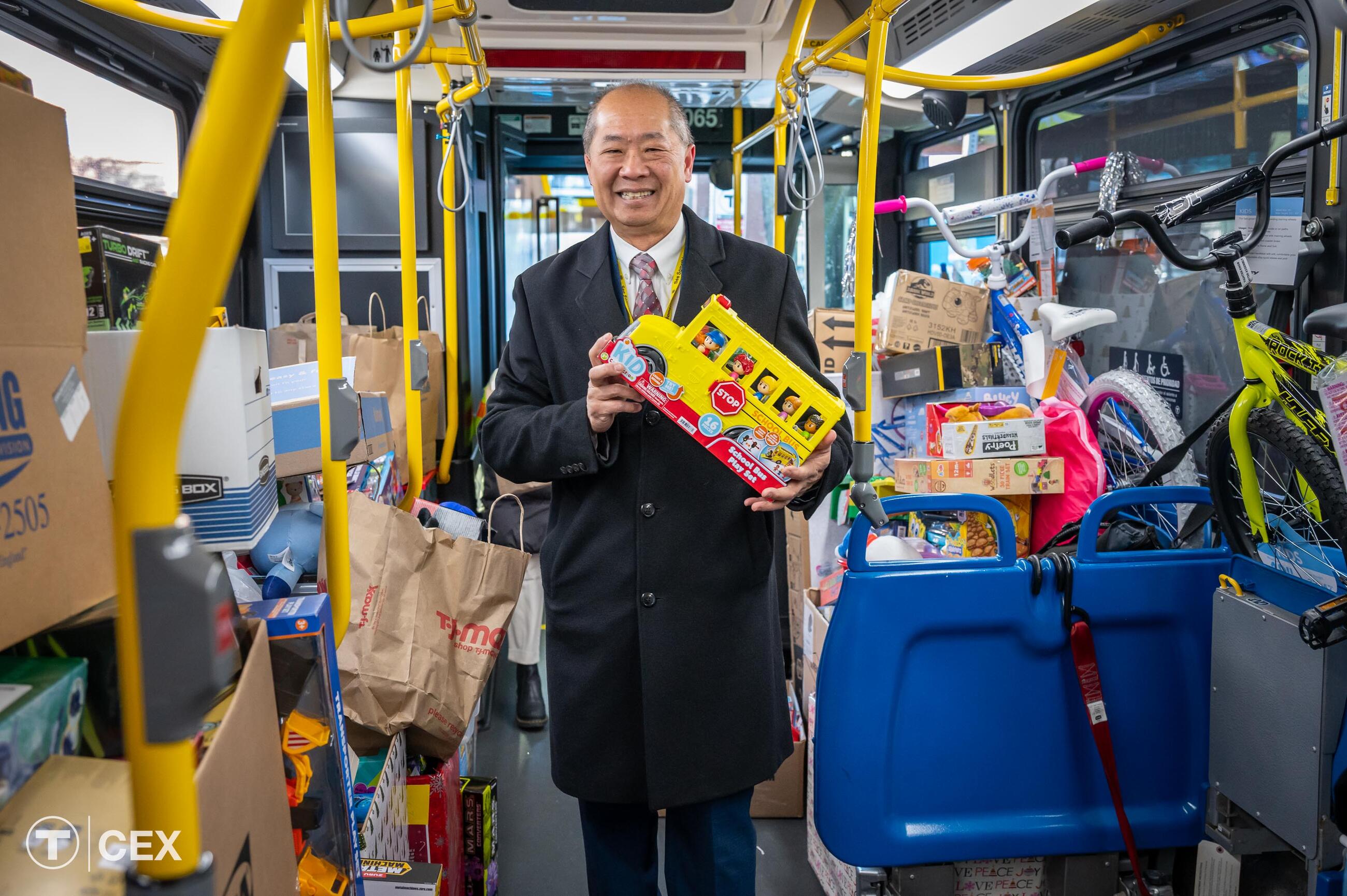 MBTA General Manager Eng showcased one of the gifts benefiting the MSPCC, the Boys and Girls Club of Boston, and Heading Home. Complimentary photo by the MBTA Customer and Employee Experience Department.