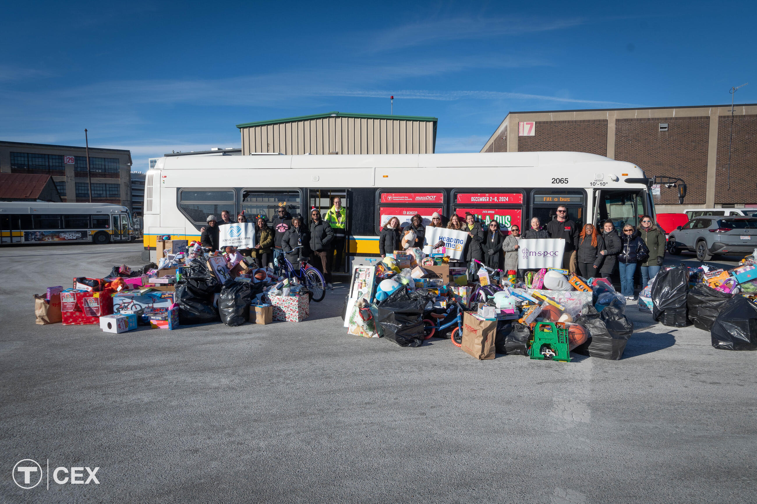  MBTA and MassDOT employees filled a bus with 2,651 gifts this year – the highest-ever toy count for the Fill-A-Bus gift drive. Complimentary photo by the MBTA Customer and Employee Experience Department.