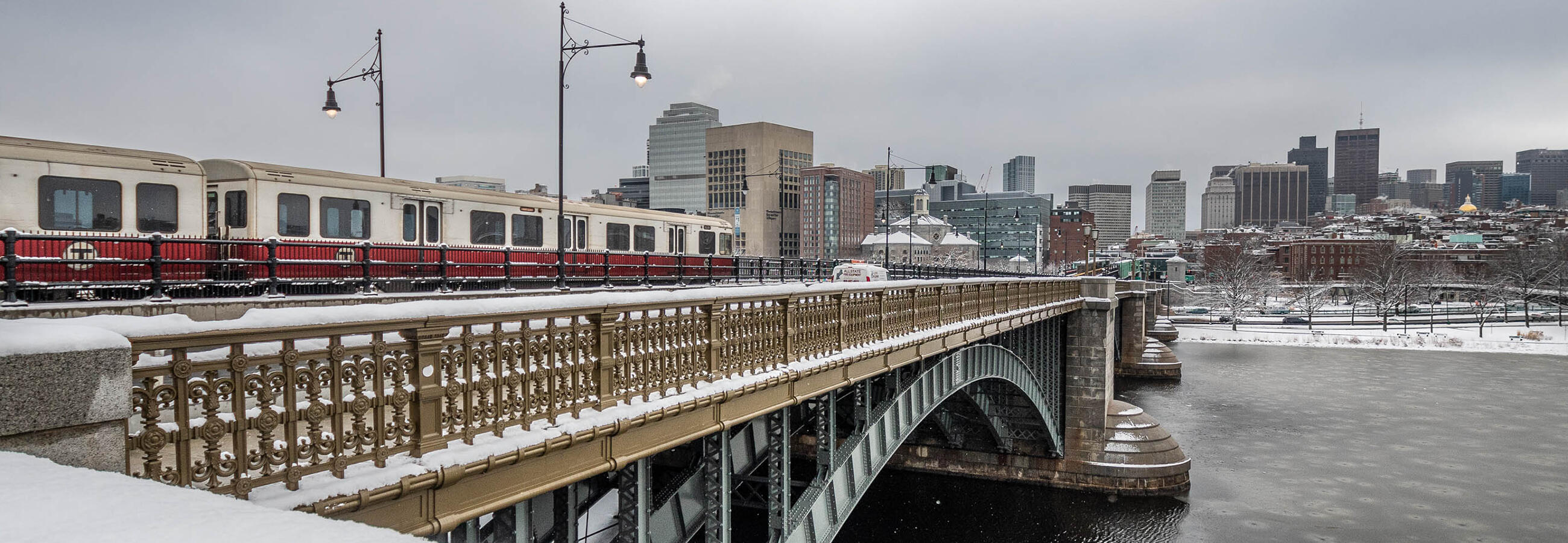 Train going over bridge suspended over water