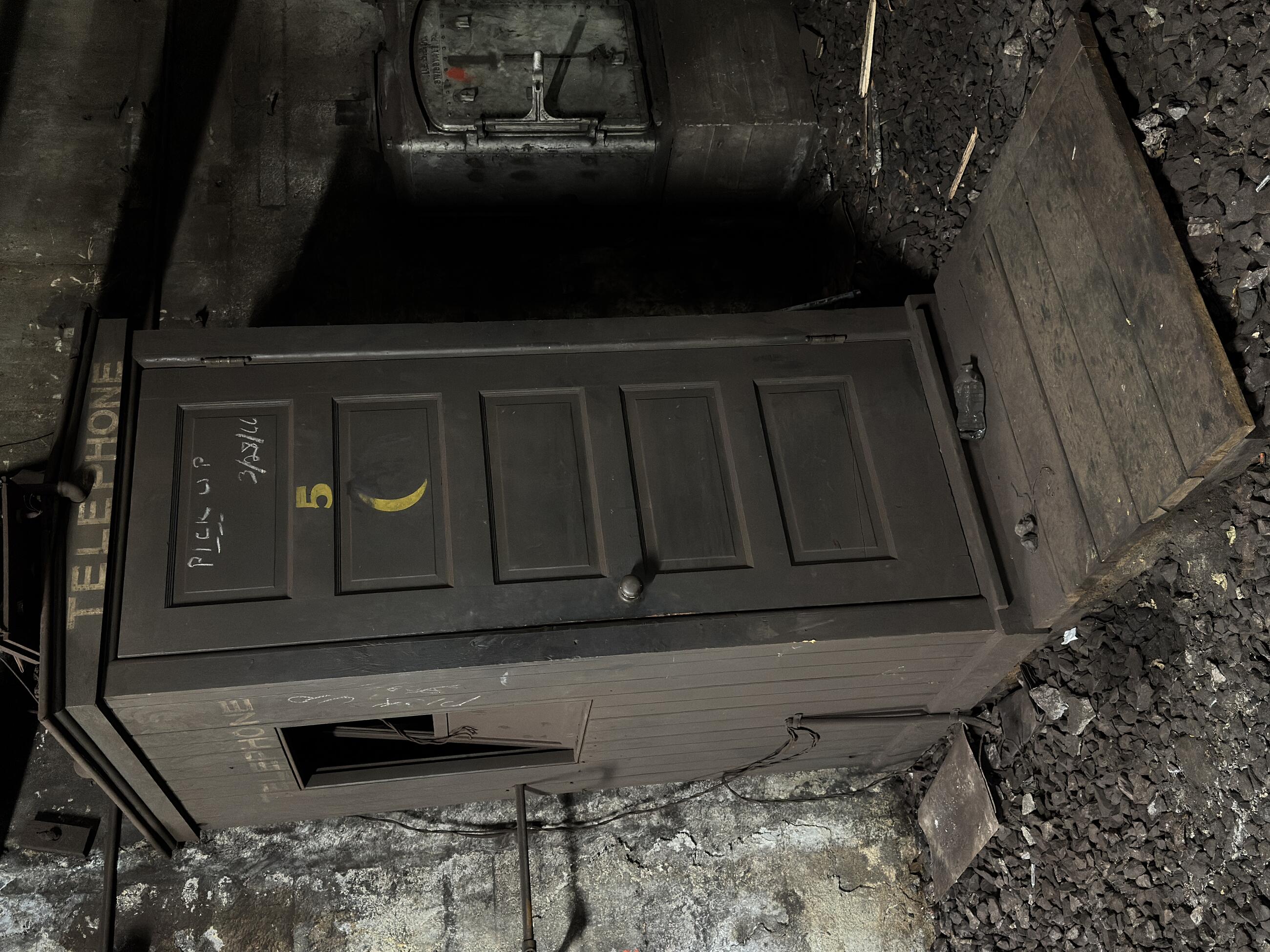 Crews discovered a century-old telephone booth at the Bowdoin loop track.