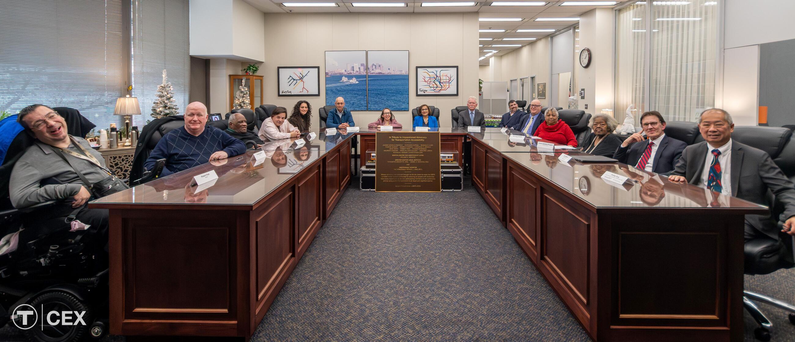 Pictured above (from L to R): Robert Park, Thomas Gilbert, Reginald Clark, Andrew Forman, Majda Abbas (GBLS), Bill Henning (BCIL), Laura Brelsford (MBTA), Taramattie Doucette (GBLS), Independent Monitor Judge Patrick King, Chris Hart (MBTA), additional GBLS counsel, Myrnairis (Mic) Cepeda, Joanne Daniels-Finegold, John Martin (MBTA), Interim MassDOT Secretary and MBTA General Manager Phillip Eng