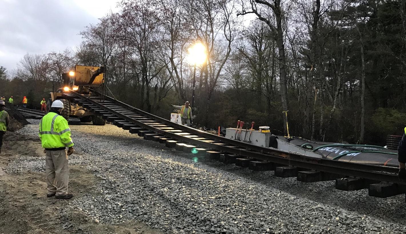 Track is reinstalled after culvert work in Berkley as part of the South Coast Rail project