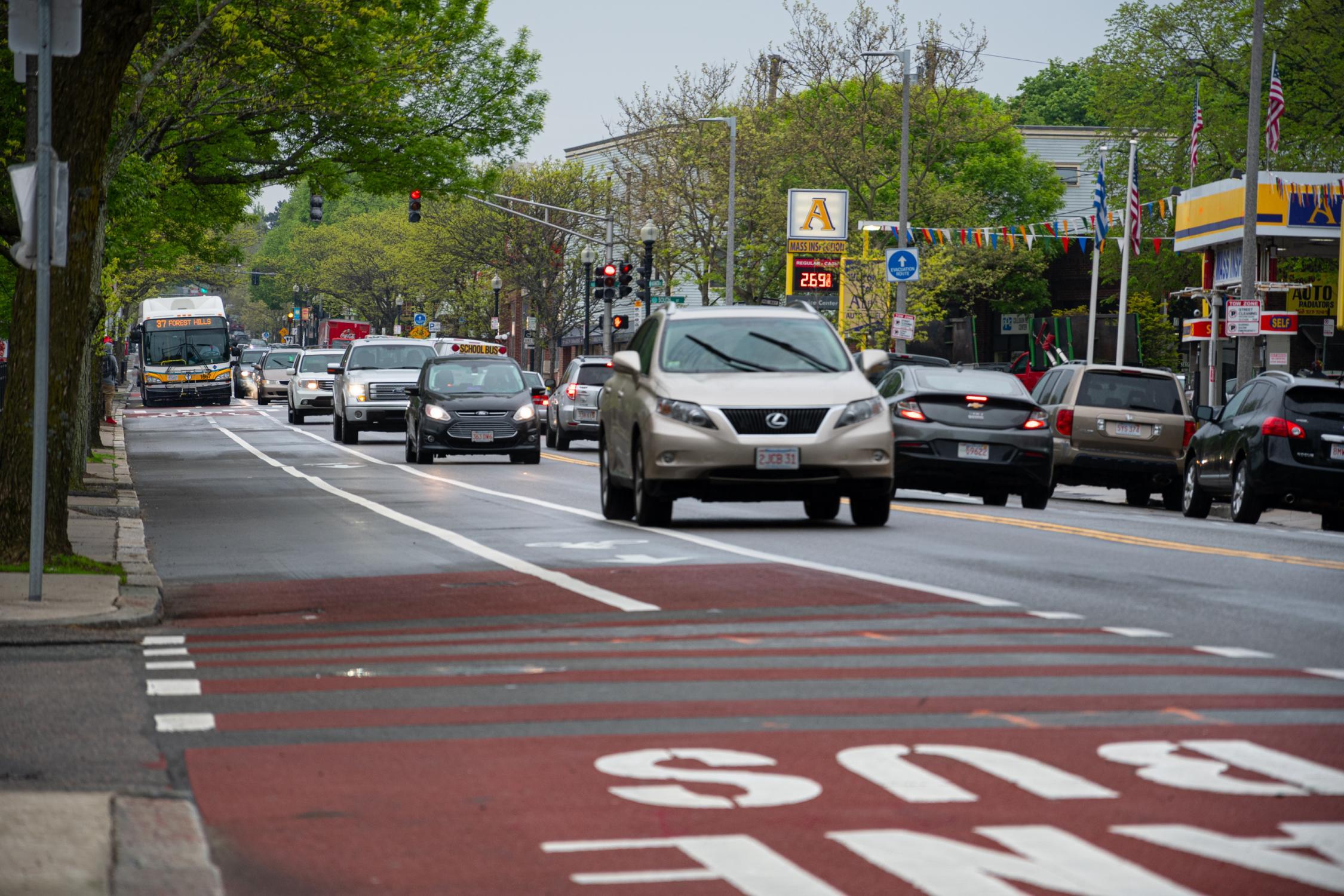 Bus-only lane on Washington Street in Roslindale, with traffic in adjacent lanes and an MBTA bus with a clear path in its own lane.