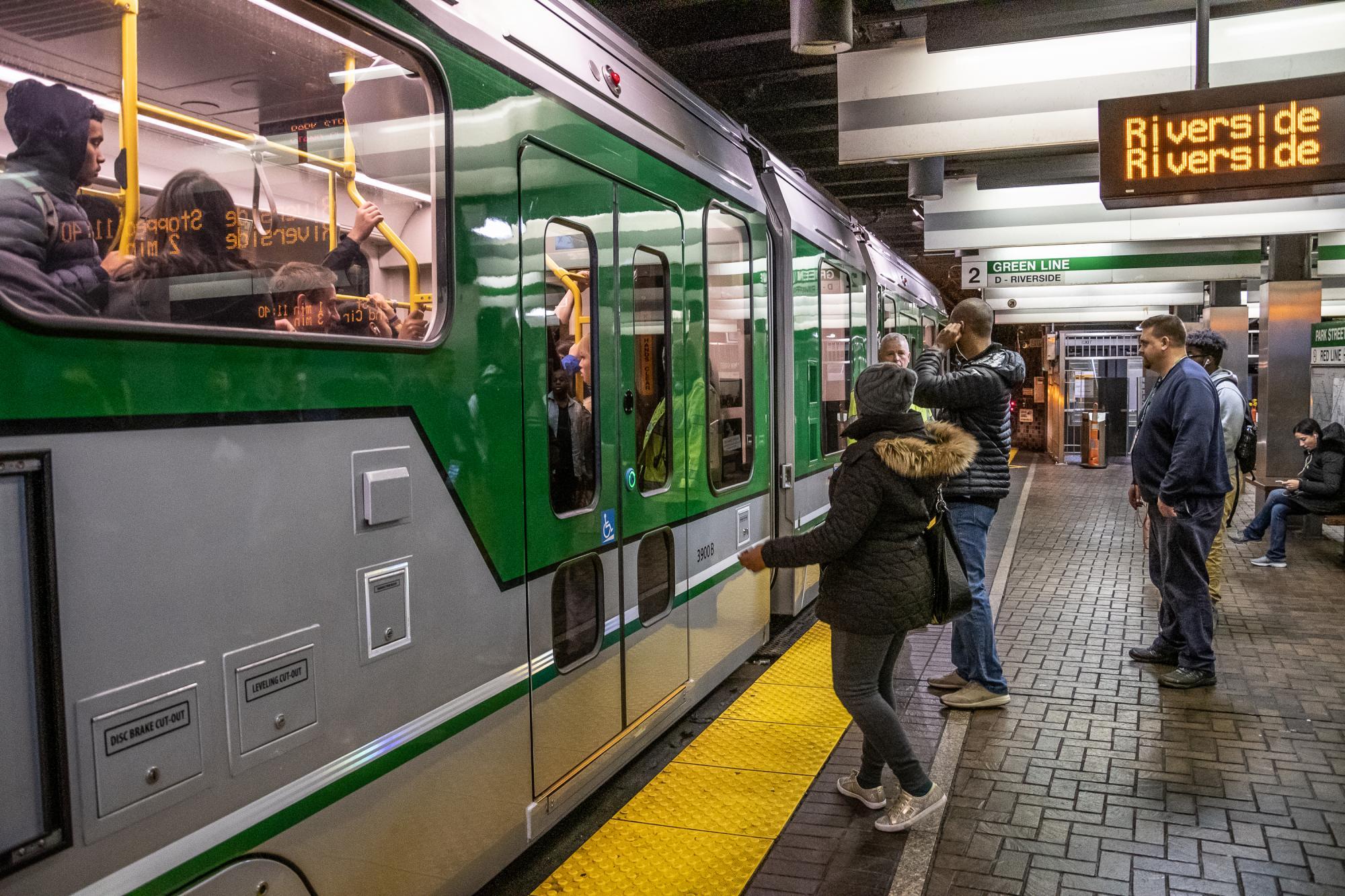 New Green Line Type 9 car at North Station, with passengers aboard and waiting on the platform