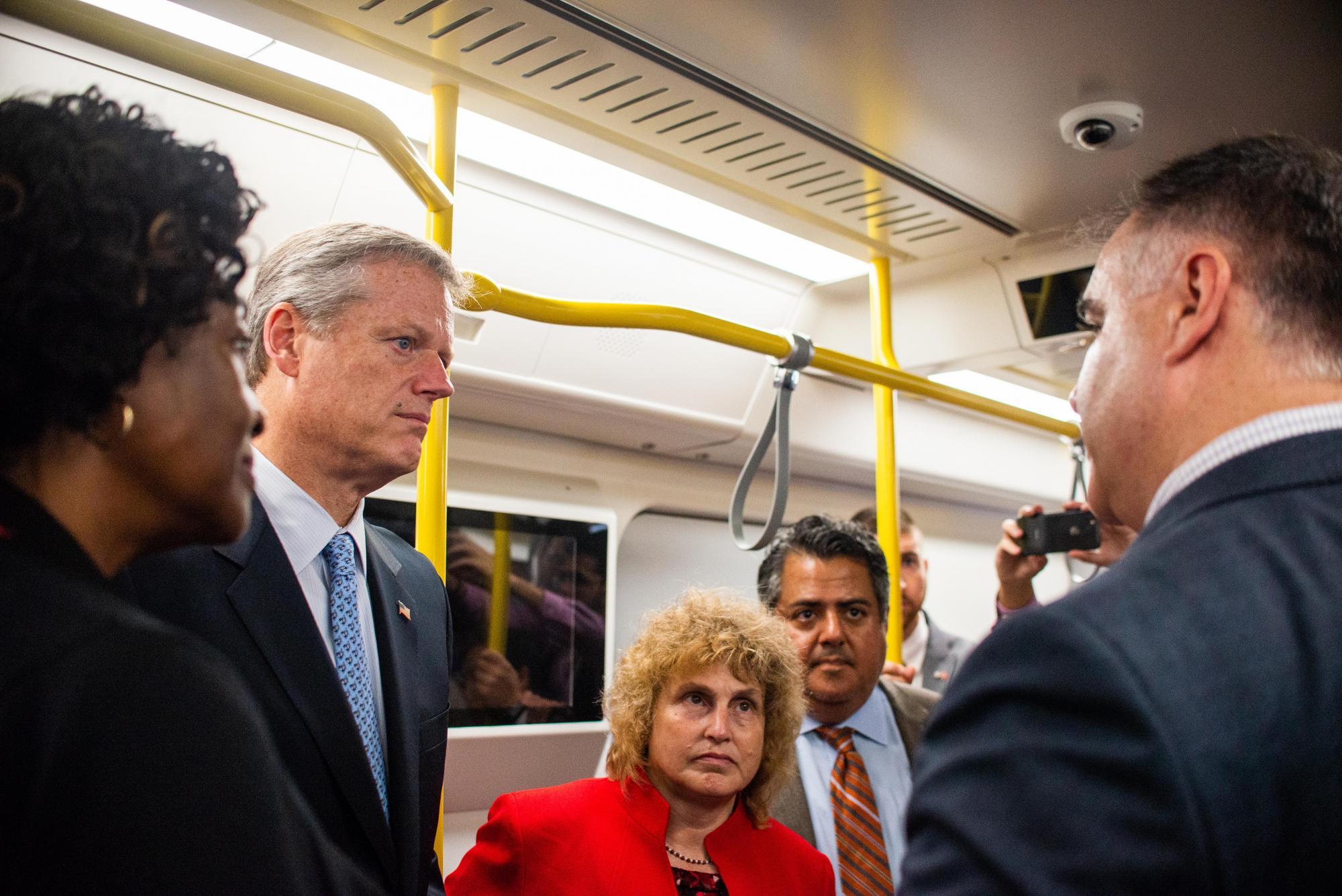 Governor Charlie Baker, Transportation Secretary Stephanie Pollack, and MBTA General Manager Luis Ramirez inside the Red Line mock-up car.