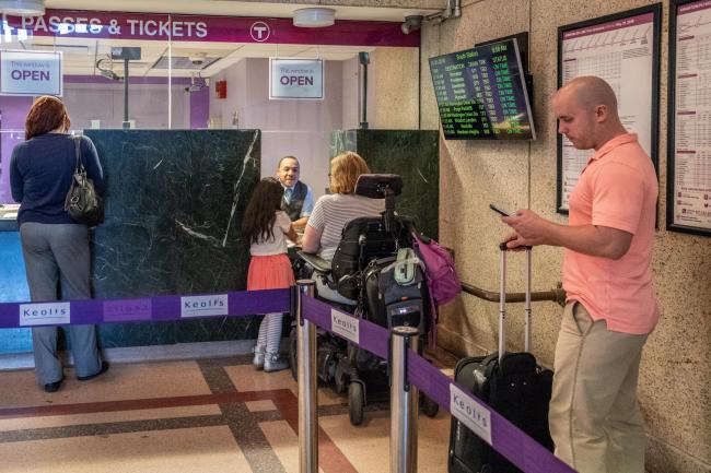 customers buying commuter rail tickets