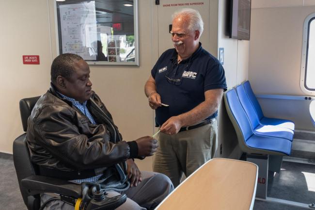 ferry crew validating fare