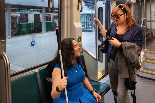 customers in green line priority seats