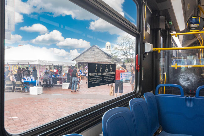 Priority seating decal on window featured on bus  