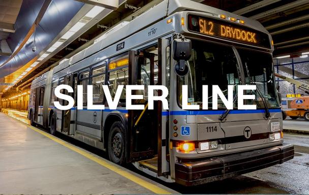 SL2 bus at World Trade Center Station. Text overlaid reads "Silver Line."