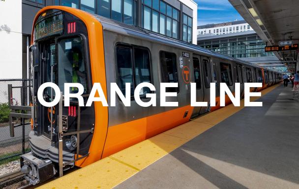 A new Orange Line train at Assembly Station, with white text overlaid reading "Orange Line"