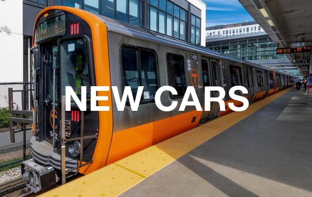 A new Orange Line train at Assembly Station, with white text overlaid reading "New Cars"
