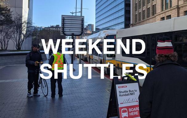 Bus shuttles replacing Red Line service, outside South Station. White text overlaid says "Weekend Shuttles."