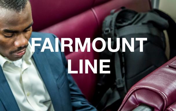 A man in a suit on the Commuter Rail. Overlaid text reads "Fairmount Line."