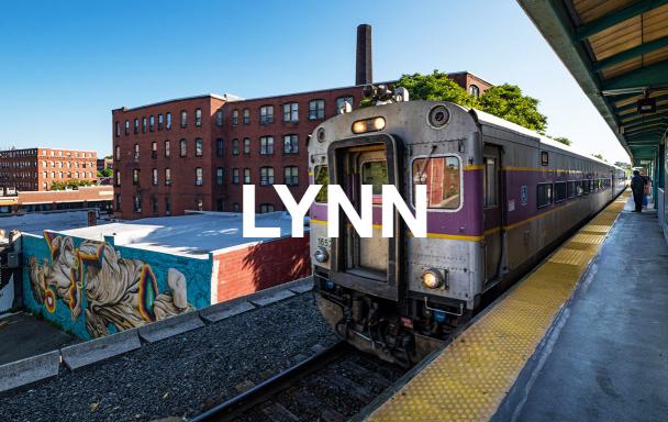 Overlaid text reads "Lynn." A Commuter Rail train pulls into Lynn - Central Square Station, with a mural in the background.
