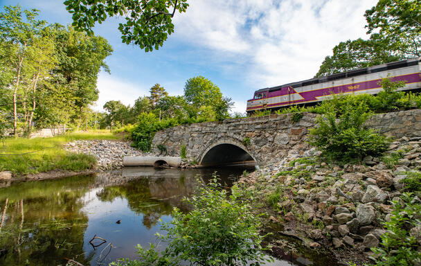 Commuter Rail passing over Shawsheen River Bridge and waterway
