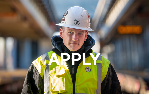 A worker on the Orange Line with a blurred background. Overlay text says Apply.