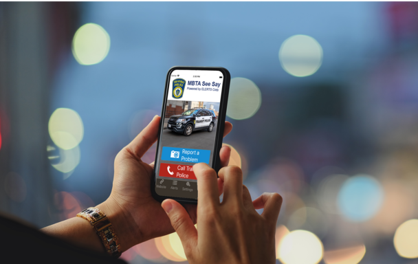 A close up of a person's cellphone in their hands while using the MBTA See Say app