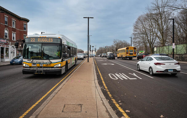 bus driving down blue hill avenue