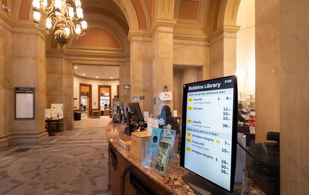 An MBTA screen in Robbins Library