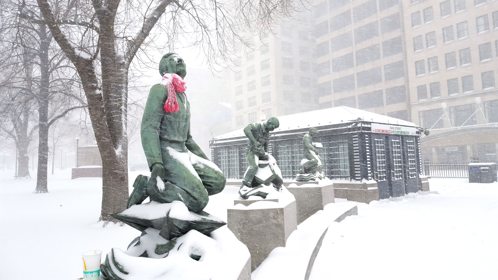 A photo of statues outside Park Street Station, covered in snow during the winter storm on January 4, 2018.